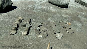 HELP spelled with mountain river rocks