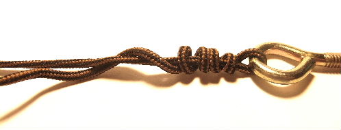 Wrap fishing line to begin tying the fishing knot