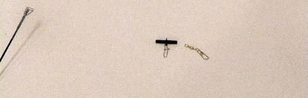 Snap Swivel is Tied onto the Fishing Line Snap Swivel is Tied onto the Fishing Line