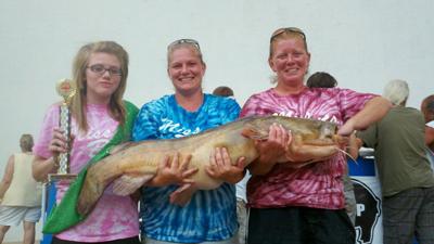 Top female team in the Okie Noodling Tournament Top females in the Okie Noodling Tournament