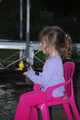 Addison Fishing and Eating a Popsicle