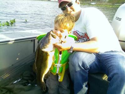 Hunter and Dad with a Pine Lake Largemouth Bass