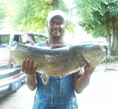 Can't help but smile for catching this big catfish!