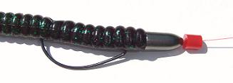10 inch powerbait plastic worm june bug color Texas rigged with a red rubber bead stopper. 10 inch powerbait plastic worm june bug color pegging with red rubber bead