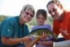 Addison and Grandparents with her Largemouth Bass